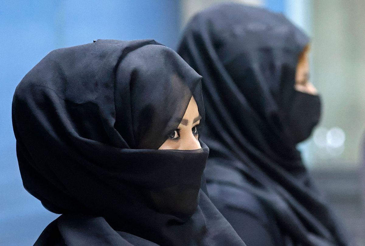 Afghan women airport workers are pictured at a security checkpoint of the airport in Kabul on September 12, 2021 (KARIM SAHIB/AFP via Getty Images)