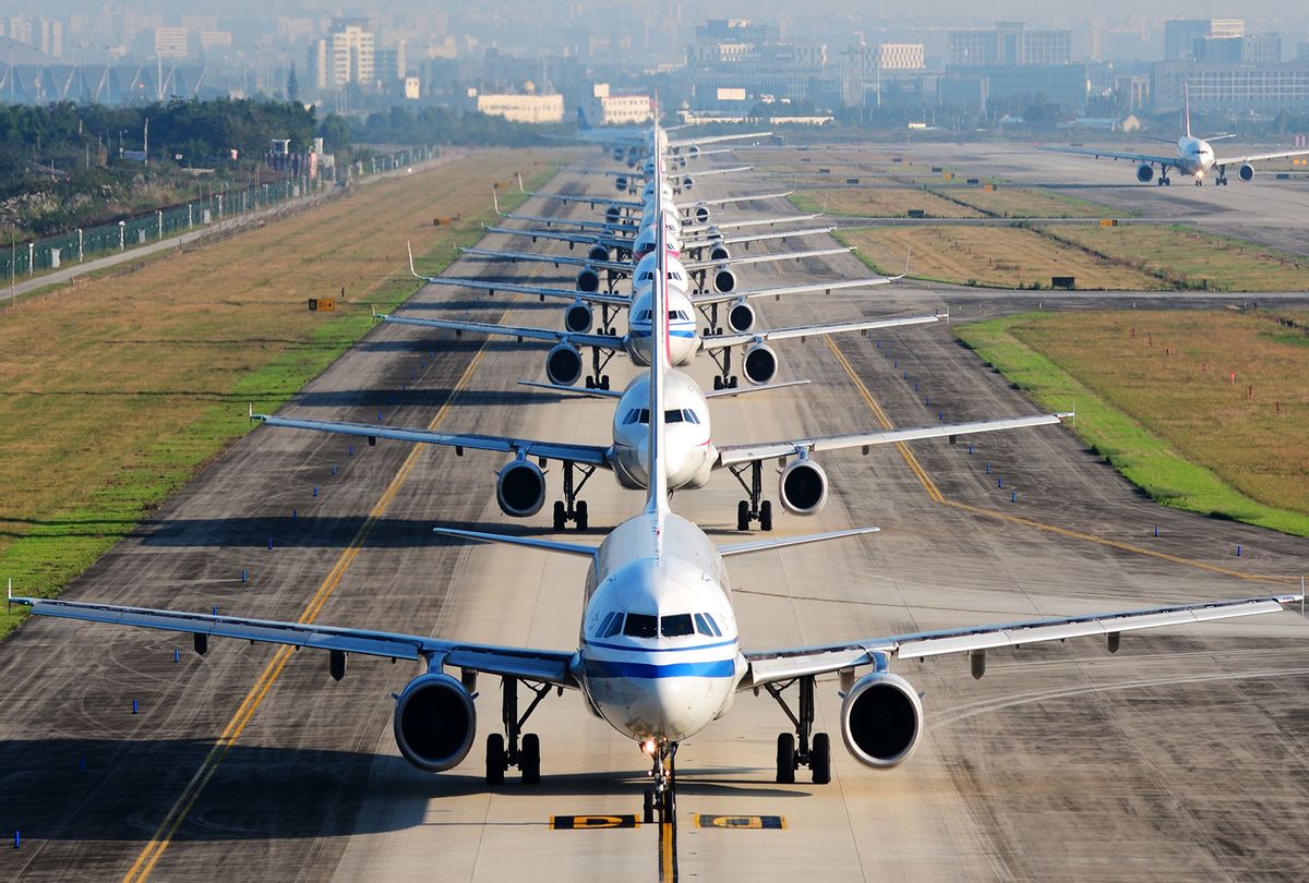 Many airplanes are in line on the runway waiting for take off (Getty Images/Jingying Zhao)