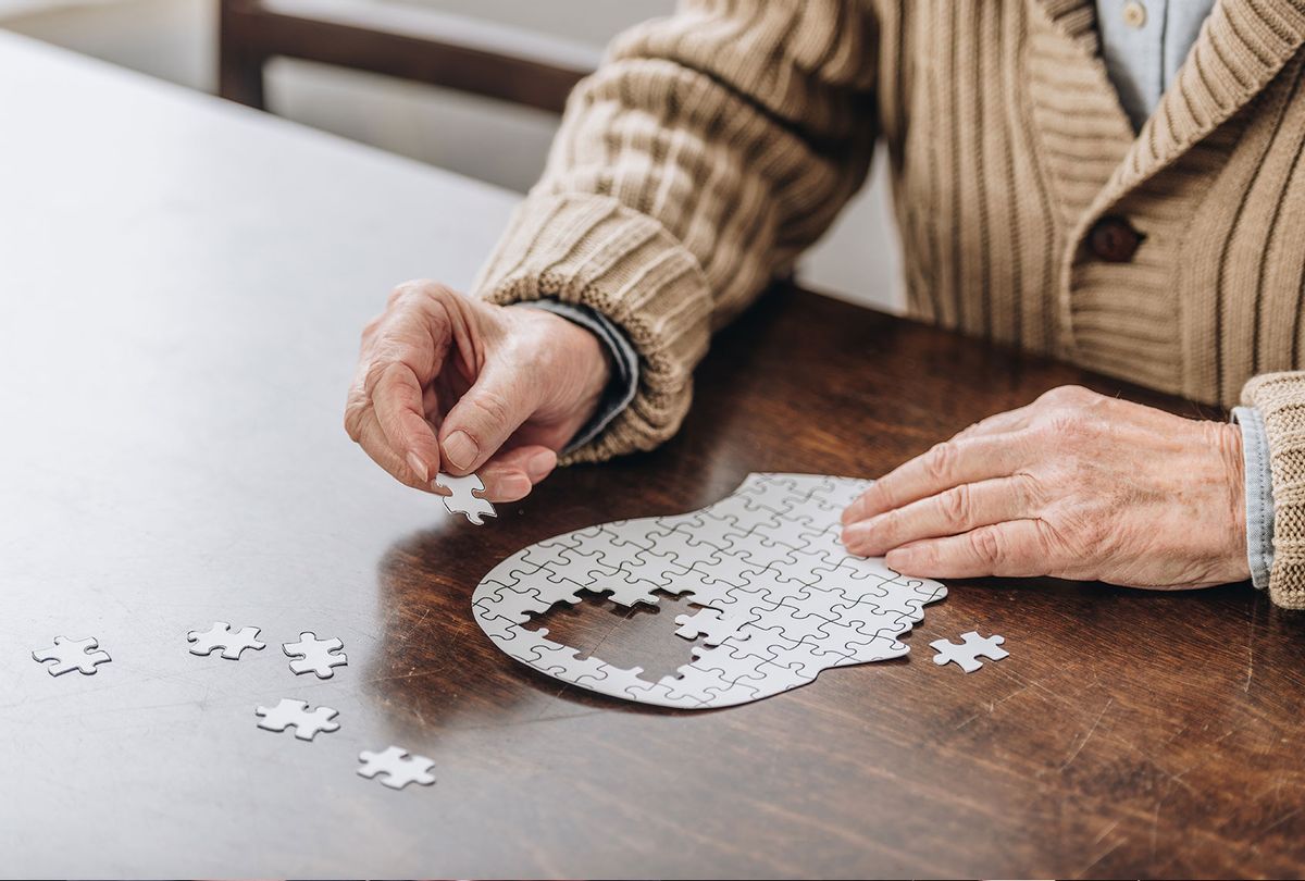 Senior man playing with puzzle (Getty Images/LightFieldStudios)