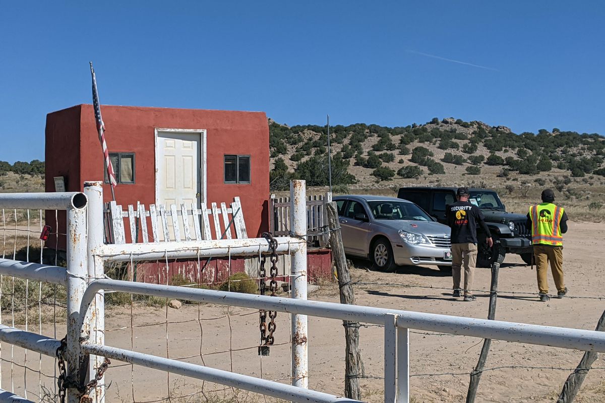 A security guard speaks to a person from the Office of the Medical Investigator at the entrance to the Bonanza Creek Ranch on October 22, 2021 in Santa Fe, New Mexico. (Getty Images)