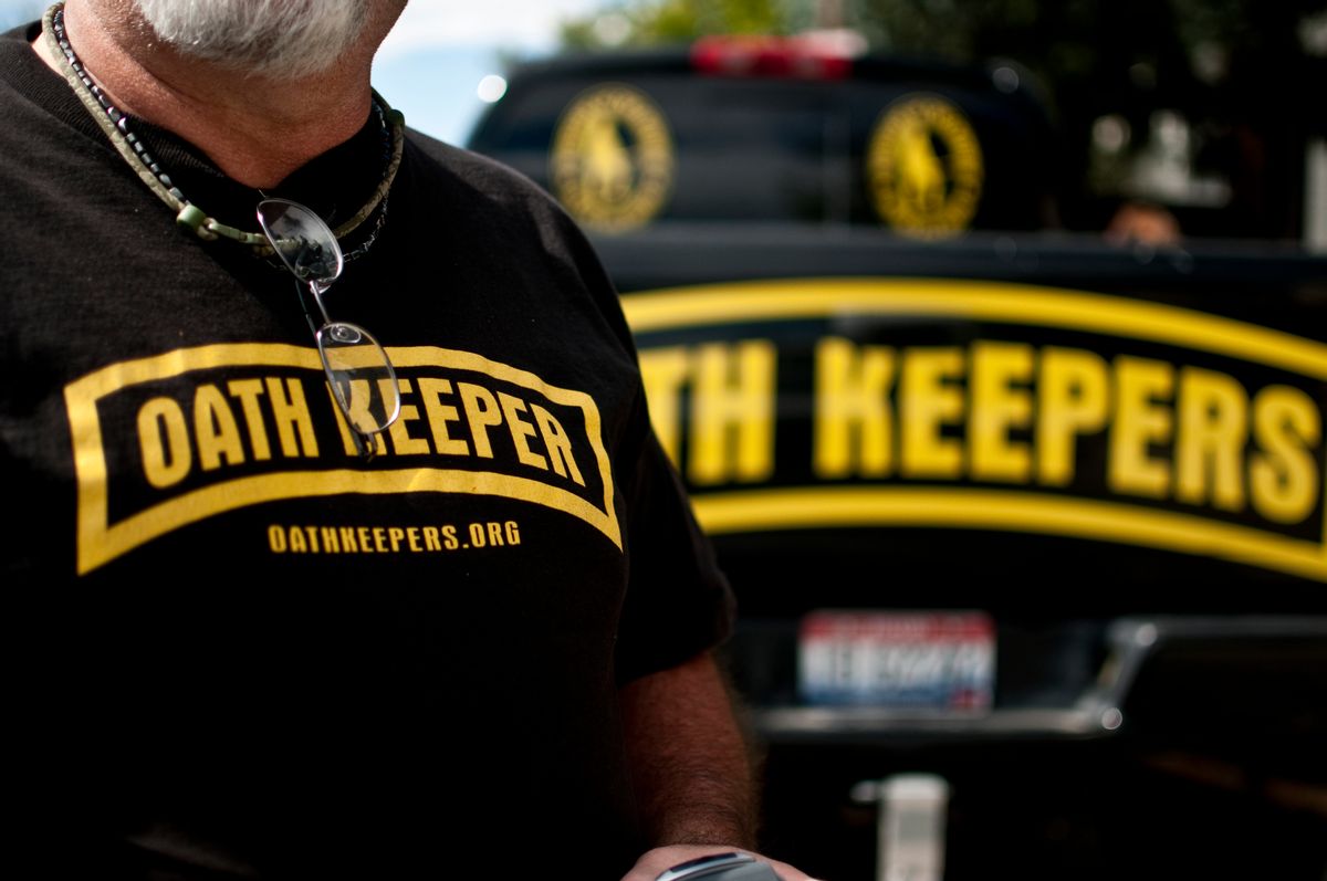 An Oath Keeper from Idaho in Bozeman, Montana, shows off his membership. (Getty Images)