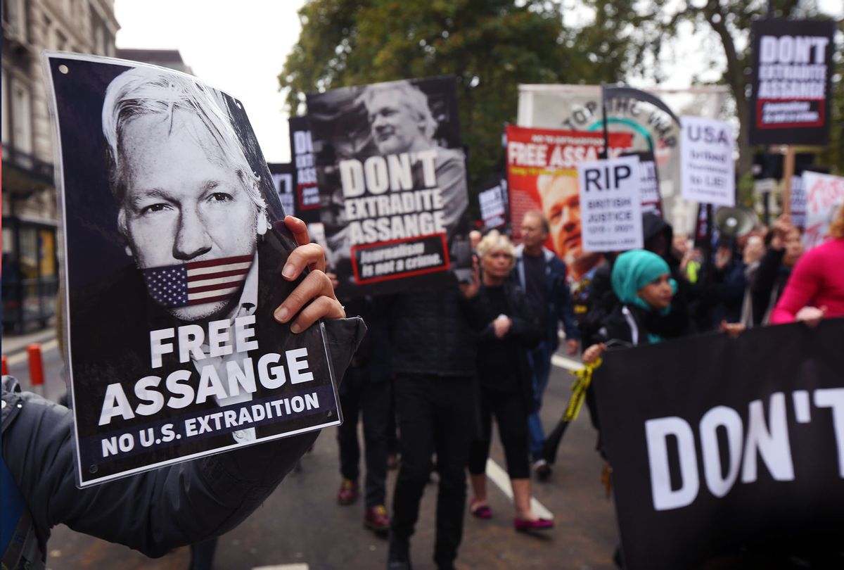 Protesters holding placards demanding Julian Assange is freed march, during a protest ahead of Julian Assange's extradition appeal on October 23, 2021 in London, England. Protesters marched from the BBC to the High Court, demanding that Julian Assange is not extradited to the USA. The Final appeal hearing is on October 27. (Martin Pope/Getty Images)