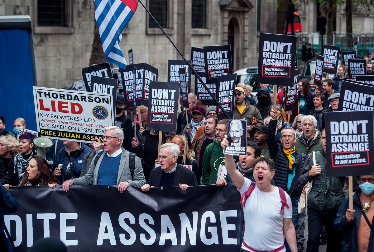 Supporters of Julian Assange marching on October 23, 2021 in London, England. Protesters march From the BBC to the High Court, demanding that Julian Assange is not extradited to the USA. (Guy Smallman/Getty Images)