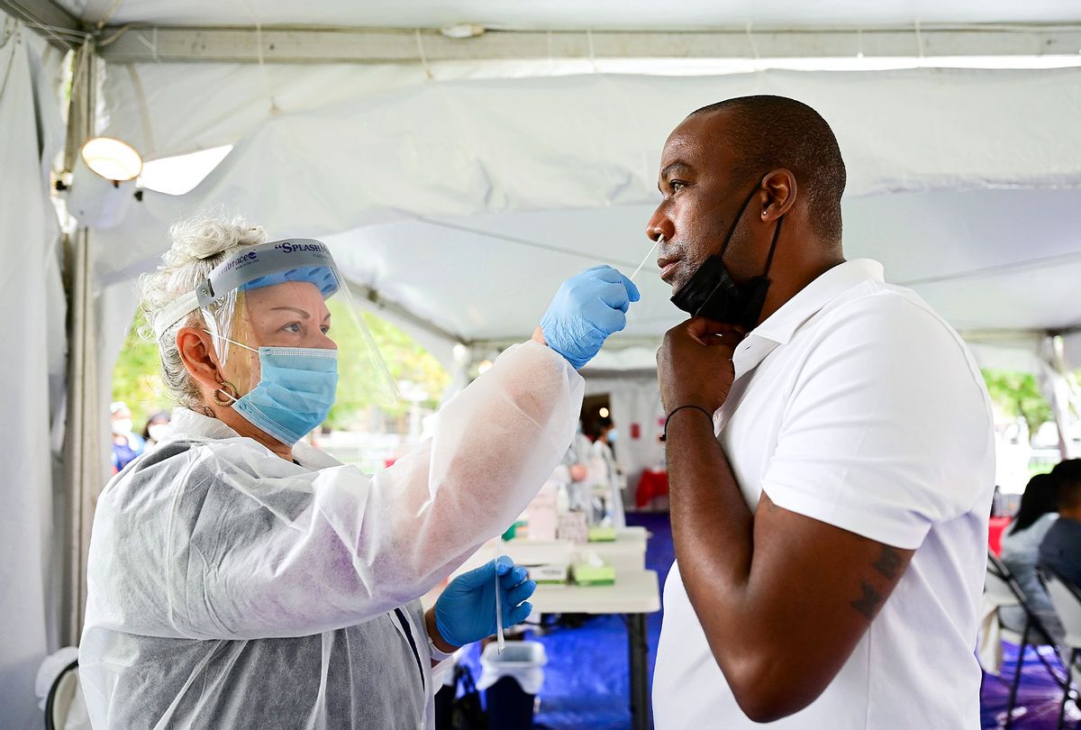 A festival attendee gets a rapid COVID-19 test during 2021 Made In America at Benjamin Franklin Parkway on September 05, 2021 in Philadelphia, Pennsylvania. (Lisa Lake/Getty Images for Roc Nation)