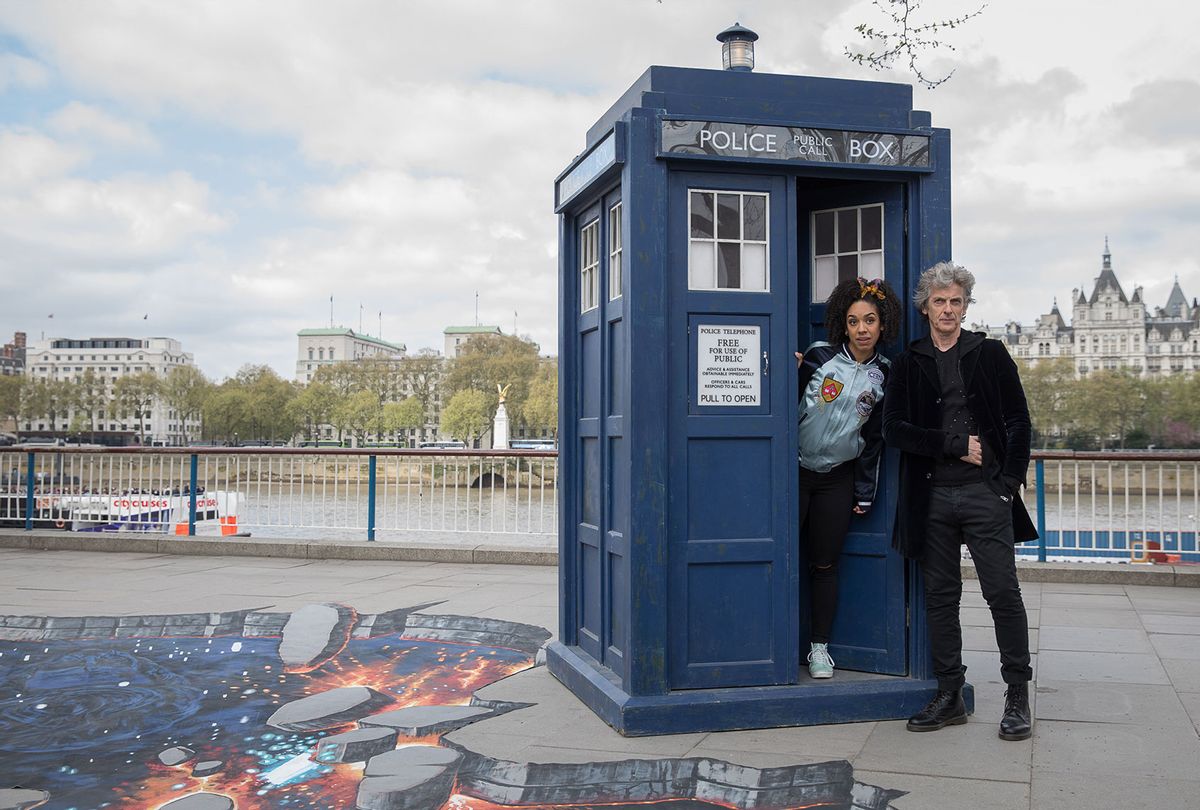 "Doctor Who" stars Peter Capaldi as The Doctor and Pearl Mackie as his companion Bill in character with the TARDIS and a huge 3D pavement painting on London's South Bank in 2017 (Tim P. Whitby/Tim P. Whitby/Getty Images)
