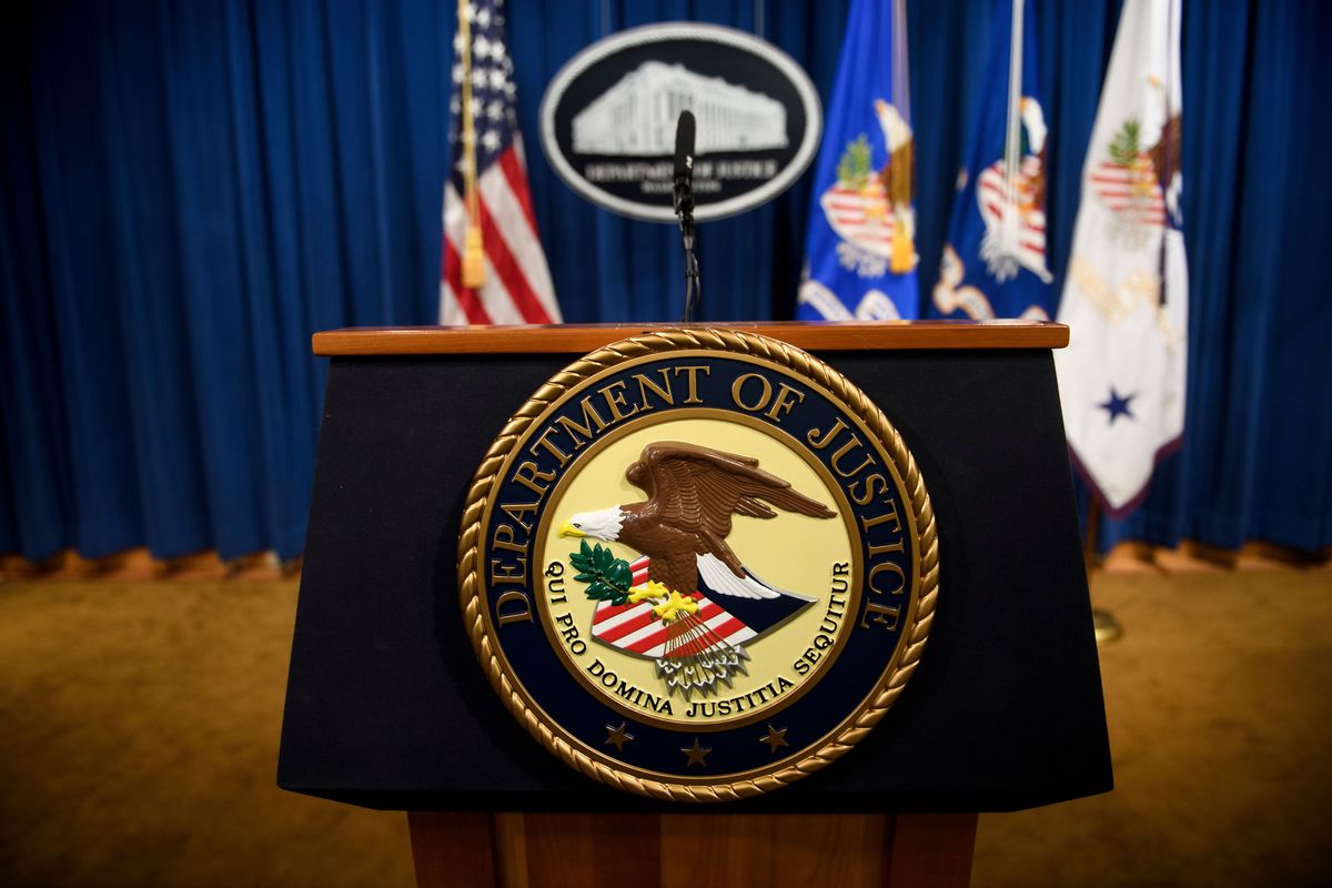A lecturn at the U.S. Department of Justice (BRENDAN SMIALOWSKI/AFP via Getty Images)