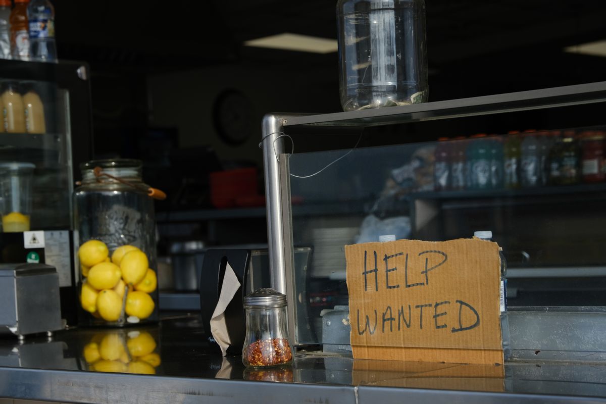 A help wanted sign is displayed at a boardwalk restaurant in the shore community of Wildwood on May 28, 2021 in Wildwood, New Jersey. (Spencer Platt/Getty Images)