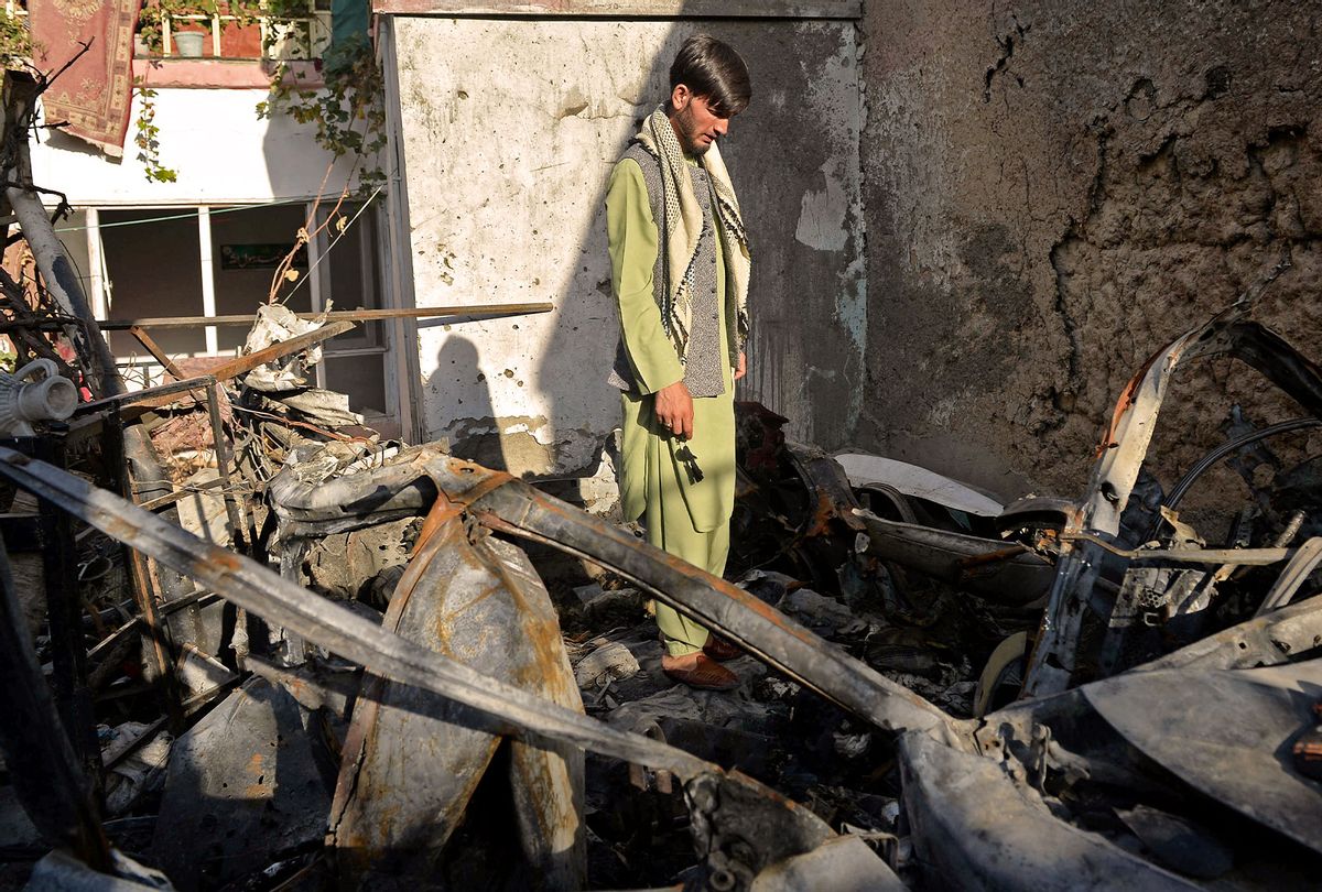 A neighbour of Ezmarai Ahmadi, stands amid the debris of Ahmadi's house that was damaged in a US drone strike in the Kwaja Burga neighbourhood of Kabul on September 18, 2021. (HOSHANG HASHIMI/AFP via Getty Images)