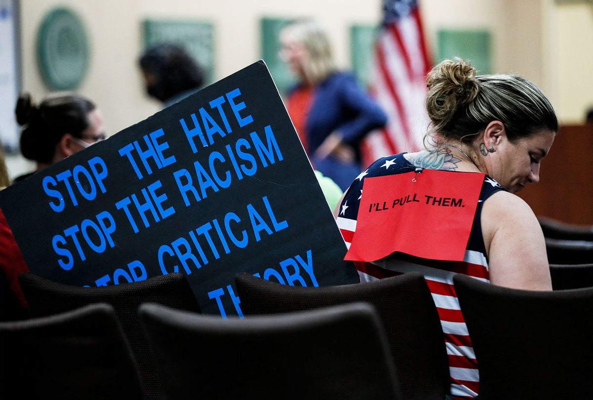 A parent sits in the gallery before the Placentia Yorba Linda School Board discusses a proposed resolution to ban teaching critical race theory in schools. (Robert Gauthier/Los Angeles Times via Getty Images)