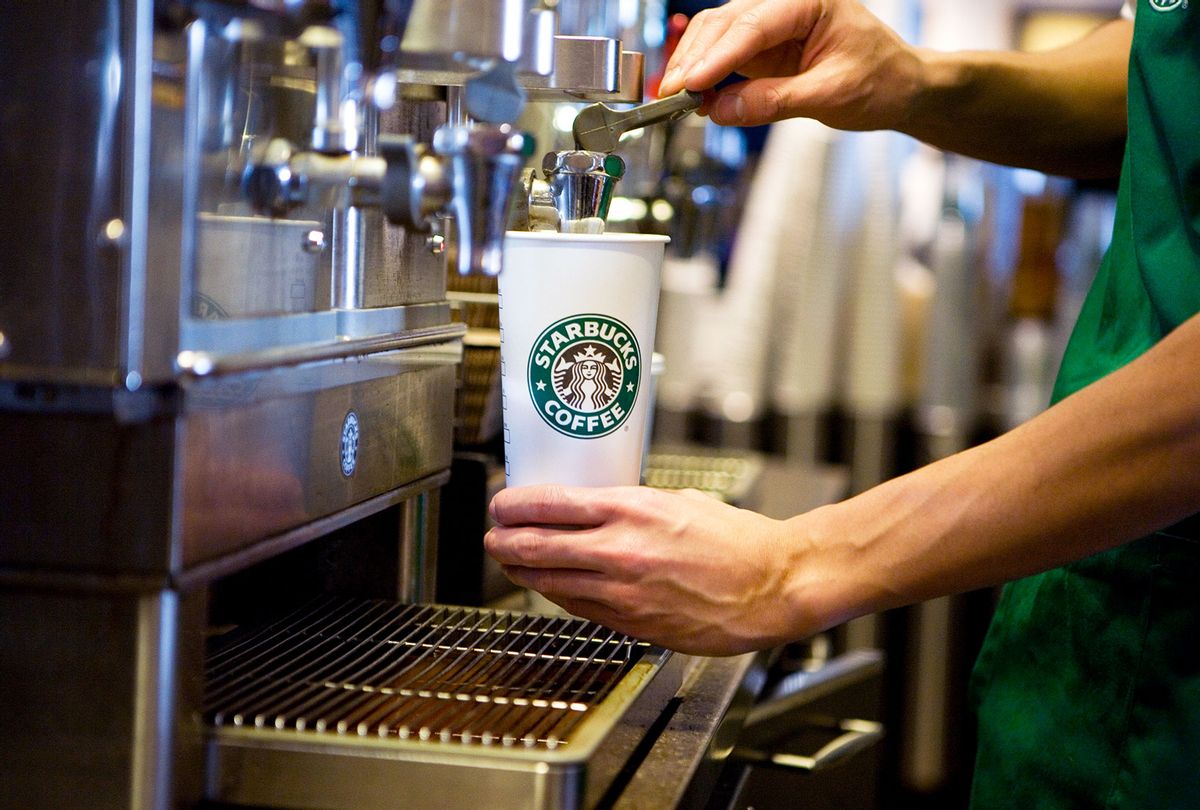A Starbucks barista prepares a drink at a Starbucks Coffee Shop location in New York (Ramin Talaie/Corbis via Getty Images)