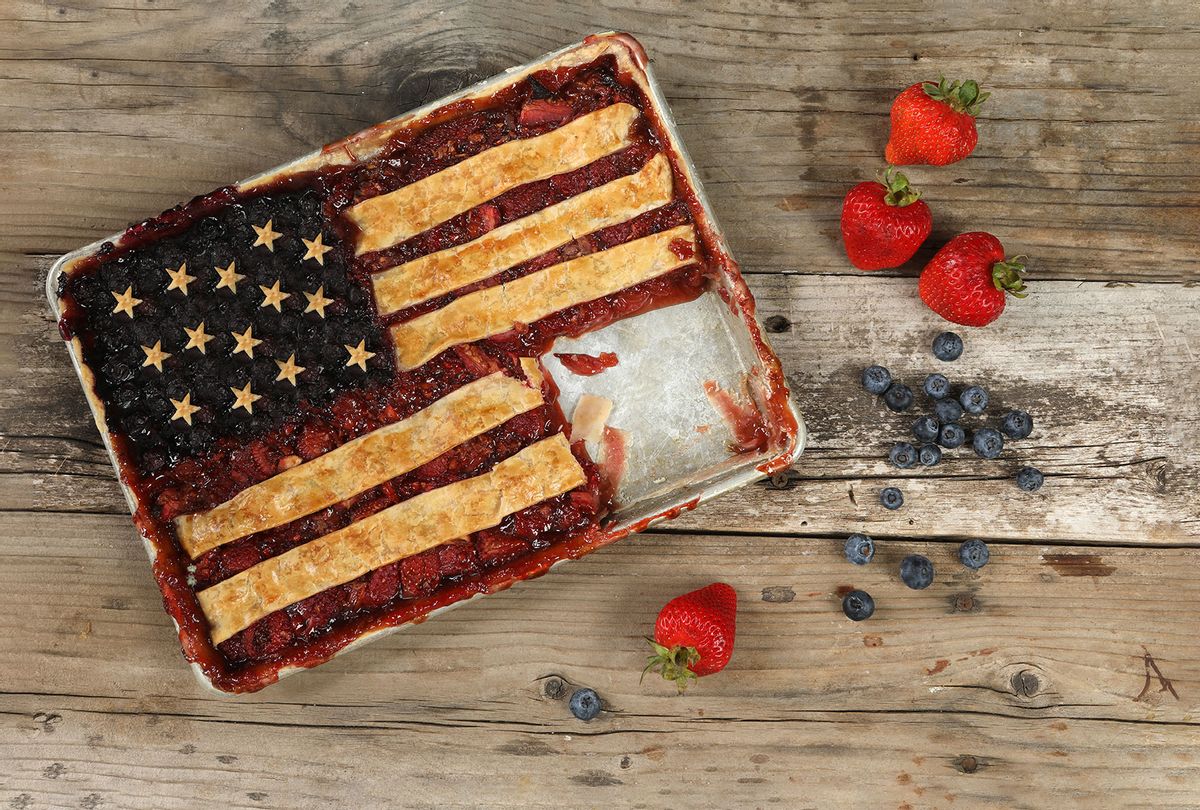 Freshly baked Blueberry and strawberry American Flag pie with a slice missing (Getty Images/DebbiSmirnoff)