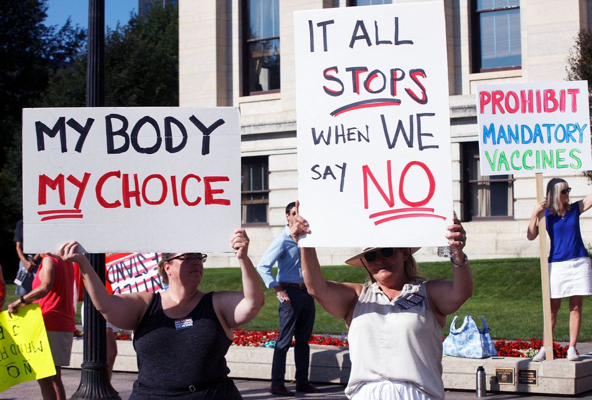 Anti-vaccine mandate protesters demonstrate, on August 24, 2021, outside of the Ohio Statehouse in Columbus, to support the Vaccine Choice and Anti-Discrimination Act, a bill that would prohibit mandatory vaccinations, and vaccination status disclosures. (STEPHEN ZENNER/AFP via Getty Images)