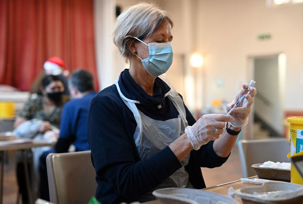 A booster dose of the Pfizer Covid-19 vaccine is drawn up in a vaccination clinic set up at St Columba's Church in Sheffield on December 15, 2021 as the UK steps up the country's booster drive to fight a "tidal wave" of Omicron. - The country's medical advisers have raised the Covid Alert Level due to a "rapid increase" in infection from the variant. (OLI SCARFF/AFP via Getty Images)