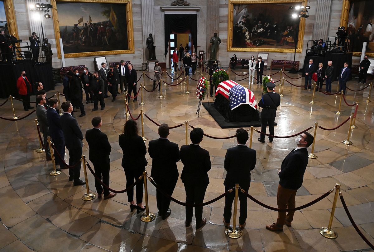 People pay their respects to former Senator Bob Dole (R-KS) in the US Capitol rotunda on December 9, 2021 in Washington, DC.  (MATT MCCLAIN/POOL/AFP via Getty Images)