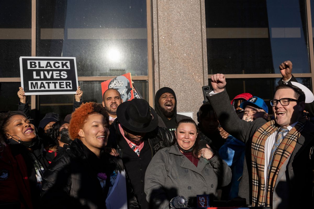 Katie Wright, center, and Aubrey Wright, left, parents of Daunte Wright, celebrate outside the Hennepin County Courthouse after the verdict was announced in the trial of former police officer Kim Potter in Minneapolis, Minnesota. (KEREM YUCEL/AFP via Getty Images)