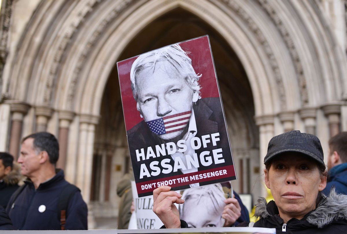 A protester seen with a placard expressing her opinion at the Royal Courts of Justice. U.S wins appeal to extradite Wikileaks founder Julian Assange from the UK. (Thomas Krych/SOPA Images/LightRocket via Getty Images)