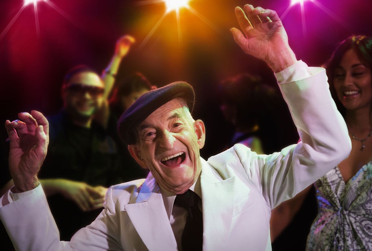 Older man dancing at a night club (Getty Images/Jose Luis Pelaez Inc)