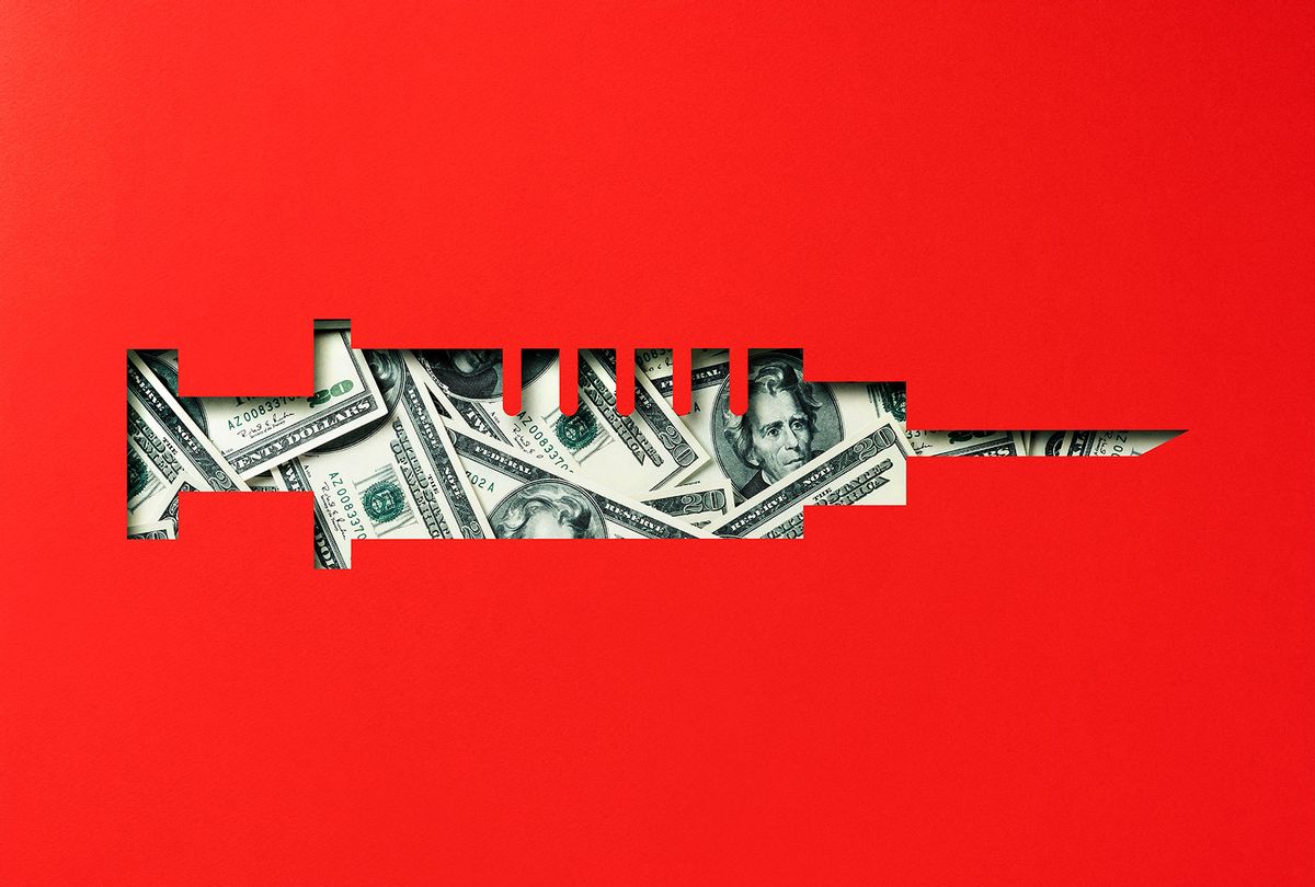Money heap under paper cutout vaccine icon (Getty Images/TARIK KIZILKAYA)