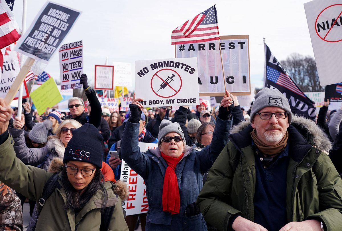 Demonstrators participate in a Defeat the Mandates march in Washington, DC, on January 23, 2022. - Demonstrators are protesting mask and Covid-19 vaccination mandates. (STEFANI REYNOLDS/AFP via Getty Images)