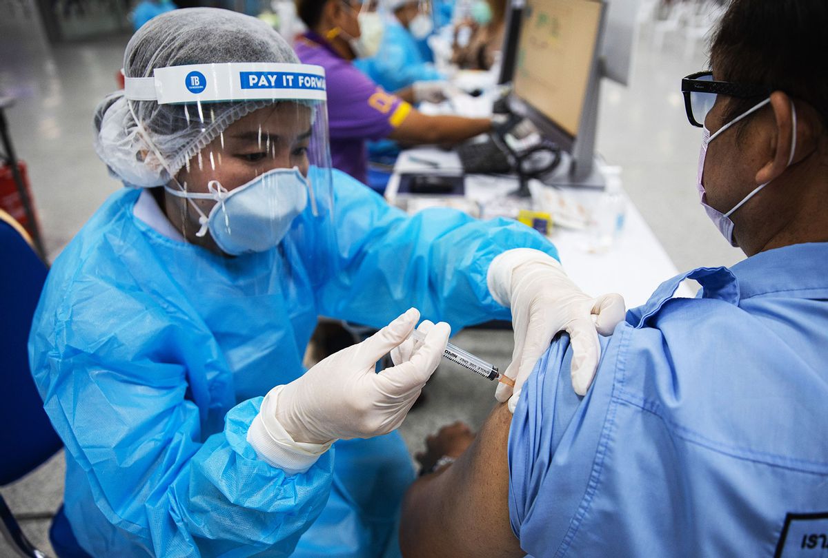 A health worker prepares to administers a dose of the COVID-19 vaccine (Varuth Pongsapipatt/SOPA Images/LightRocket via Getty Images)