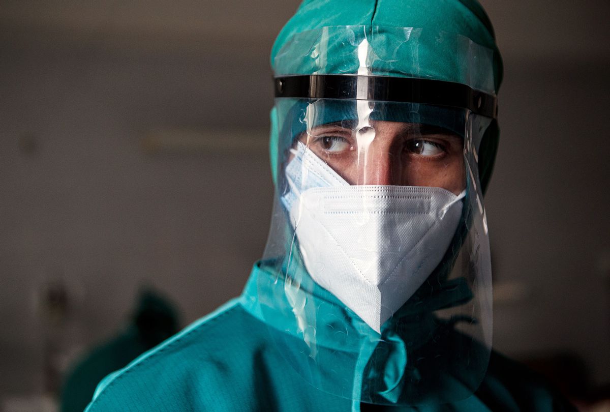 Doctor in PPE that includes a face shield and two face masks is on duty in the Zakarpattia Regional Clinical Infectious Diseases Hospital that treats COVID-19 patients, Uzhhorod, Zakarpattia Region, western Ukraine. (Serhii Hudak/ Ukrinform/Barcroft Media via Getty Images)