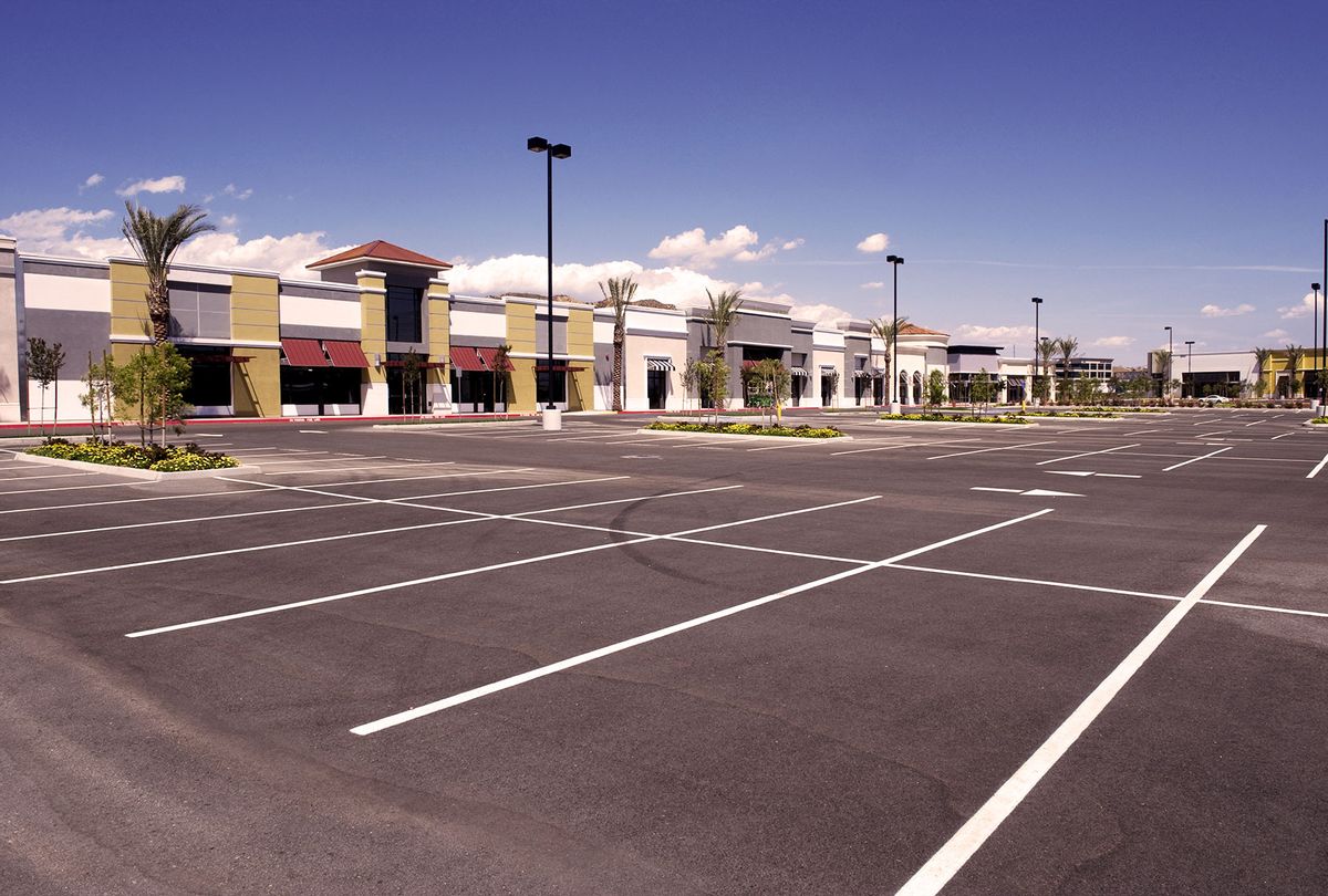 Empty strip-mall parking lott (Getty Images/kevinjeon00)