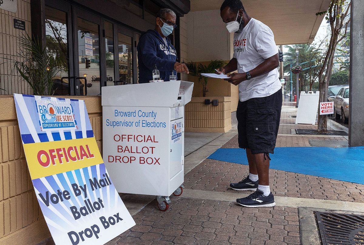 A Florida voter prepares to place his ballot in a vote by mail ballot drop box during the Congressional district 20 elections on January 11, 2022 in Ft. Lauderdale, Florida. Candidates are competing to take over the seat of the late Rep. Alcee Hastings (D-FL), who had assumed office on January 3, 1993, and served until his death on April 6, 2021. (Joe Raedle/Getty Images)