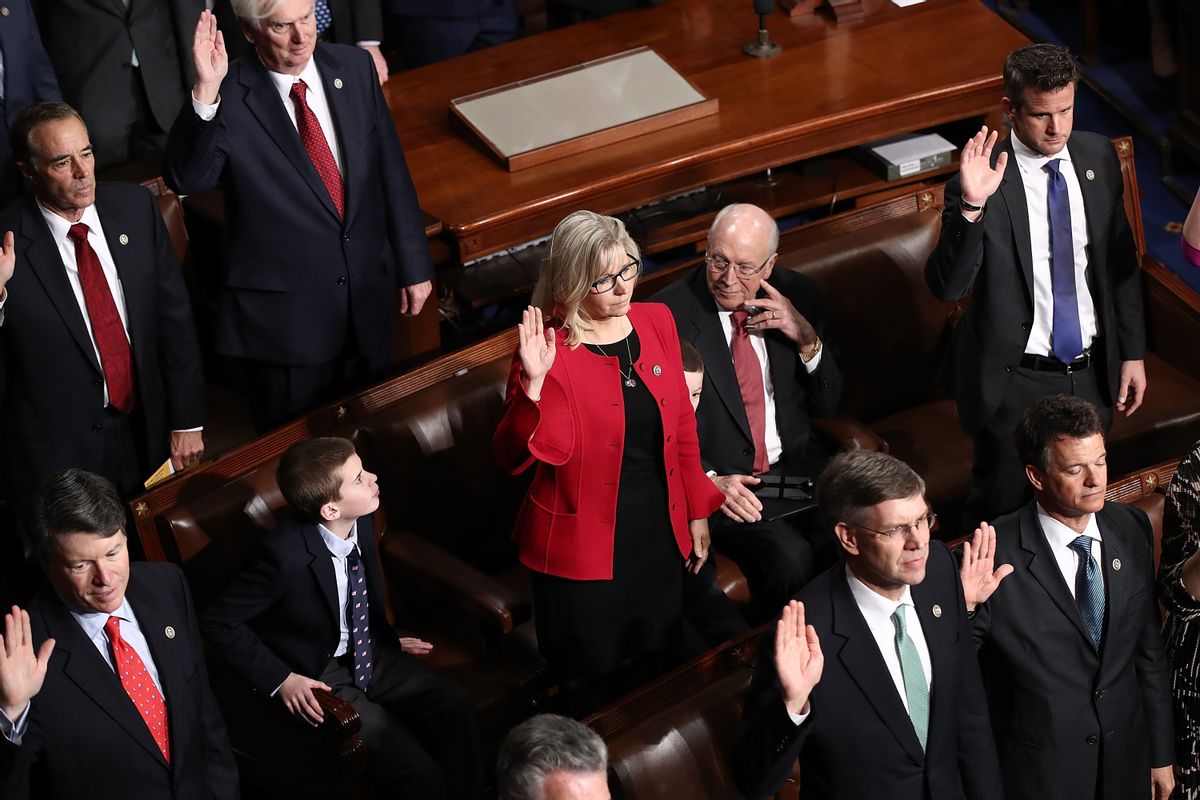 Rep. Liz Cheney, R-WY, takes her oath of office as her father, former U.S. Vice President Dick Cheney, looks on. (Win McNamee/Getty Images)