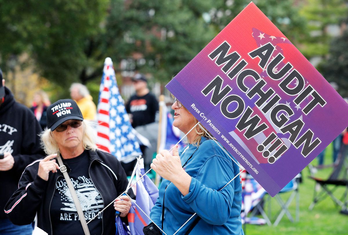 Protesters call for a "forensic audit" of the 2020 presidential election, during a demonstration by a group called Election Integrity Fund and Force outside of the Michigan State Capitol , in Lansing, on October 12, 2021. (JEFF KOWALSKY/AFP via Getty Images)