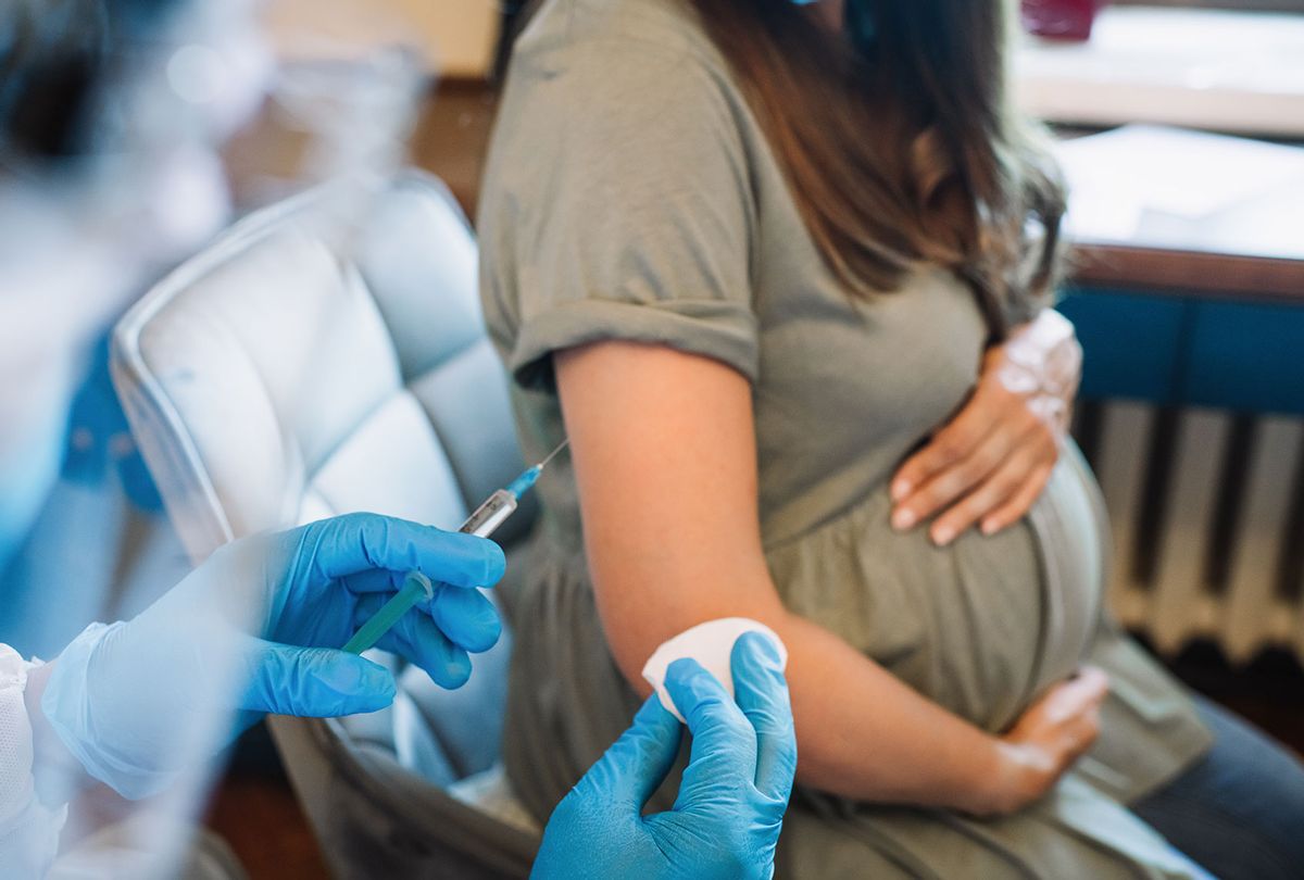 Pregnant woman getting vaccine (Getty Images/ArtMarie)