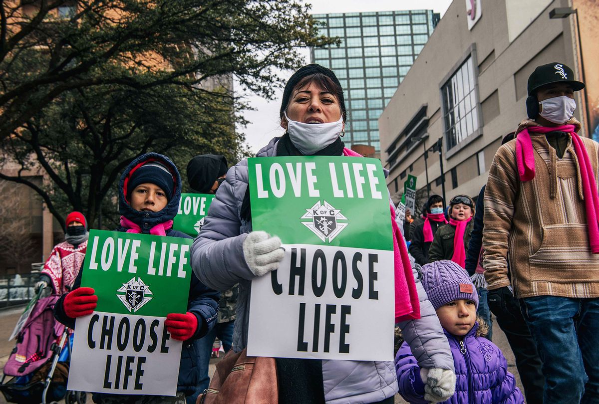 Pro-life demonstrators march during the "Right To Life" rally on January 15, 2022 in Dallas, Texas. The Catholic Pro-Life Community, Texans for Life Coalition, the Catholic Diocese of Dallas, and the Diocese of Fort Worth North hosted the Texas March for Life rally where people gathered to instigate the overturning of Roe v. Wade, a Supreme Court decision that permitted states throughout the country in legalizing abortion under certain regulations. The 49th anniversary of the decision to legalize abortion falls on January 22. (Brandon Bell/Getty Images)