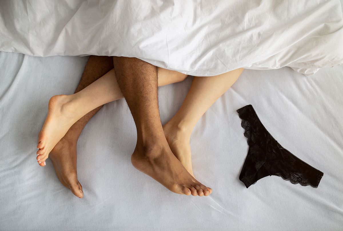 The legs of a couple in bed (Prostock-Studio/Getty)