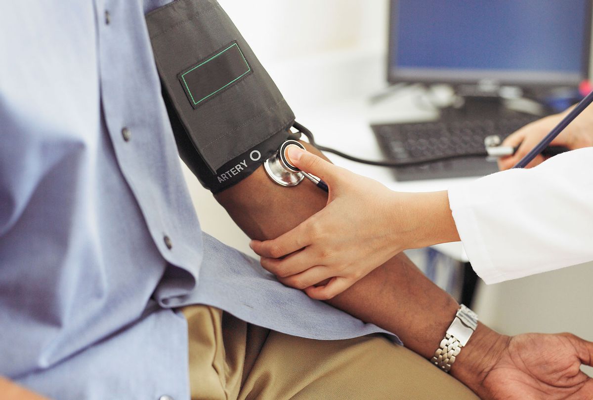Doctor taking patient's blood pressure (Getty Images/Siri Stafford)