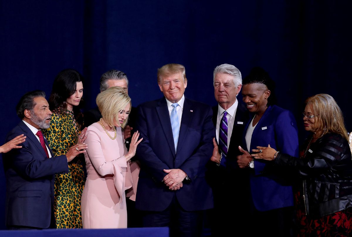 Faith leaders pray over President Donald Trump during a 'Evangelicals for Trump' campaign event held at the King Jesus International Ministry on January 03, 2020 in Miami, Florida. The rally was announced after a December editorial published in Christianity Today called for the President Trump's removal from office. (Joe Raedle/Getty Images)