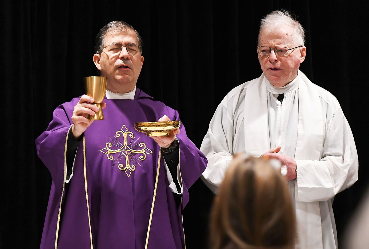 Father Frank Pavone, National Director of Priests for Life (left), celebrates Catholic Mass for attendees at the 2021 Conservative Political Action Conference at the Hyatt Regency. (Paul Hennessy/SOPA Images/LightRocket via Getty Images)