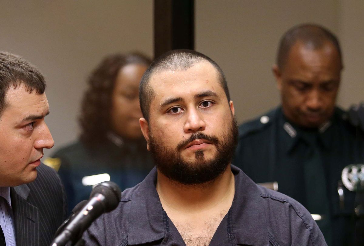 George Zimmerman, the acquitted shooter in the death of Trayvon Martin, listens to defense counsel Daniel Megaro (L) during a first-appearance hearing on charges including aggravated assault stemming from a fight with his girlfriend November 19, 2013 in Sanford, Florida. Zimmerman, 30, was arrested after police responded to a domestic disturbance call at a house. He was acquitted in July of all charges in the shooting death of unarmed, black teenager, Trayvon Martin. (Joe Burbank-Pool/Getty Images)