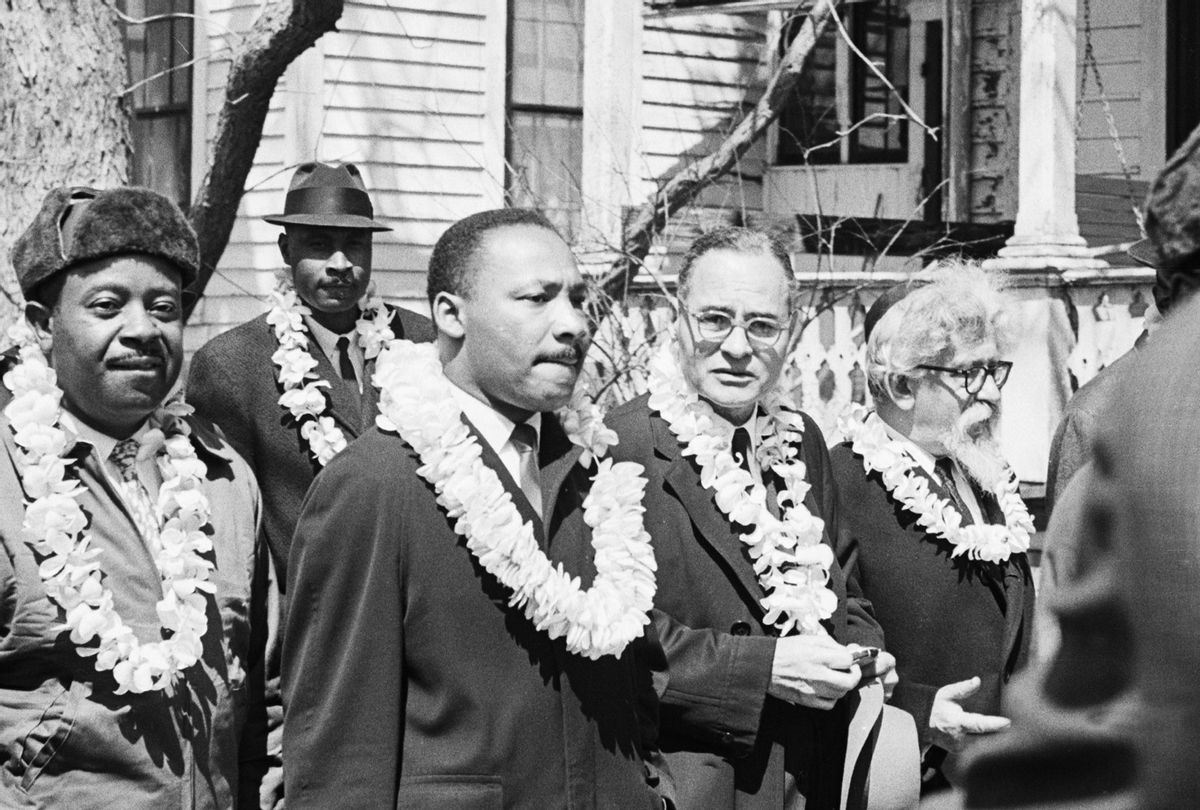 Civil rights leaders Ralph Abernathy, Martin Luther King Jr., former UN Ambassador Ralph Bunche, and Rabbi Abraham Joshua Heschel (l-r) wear leis during the start of a march from Selma to Montgomery, Alabama. The leis were given to the marchers from a group from Hawaii. (Getty Images/Bettmann)