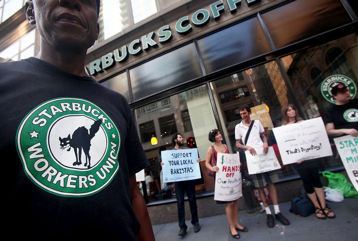 Starbucks baristas and supporters protest outside a Manhattan Starbucks (Mario Tama/Getty Images)