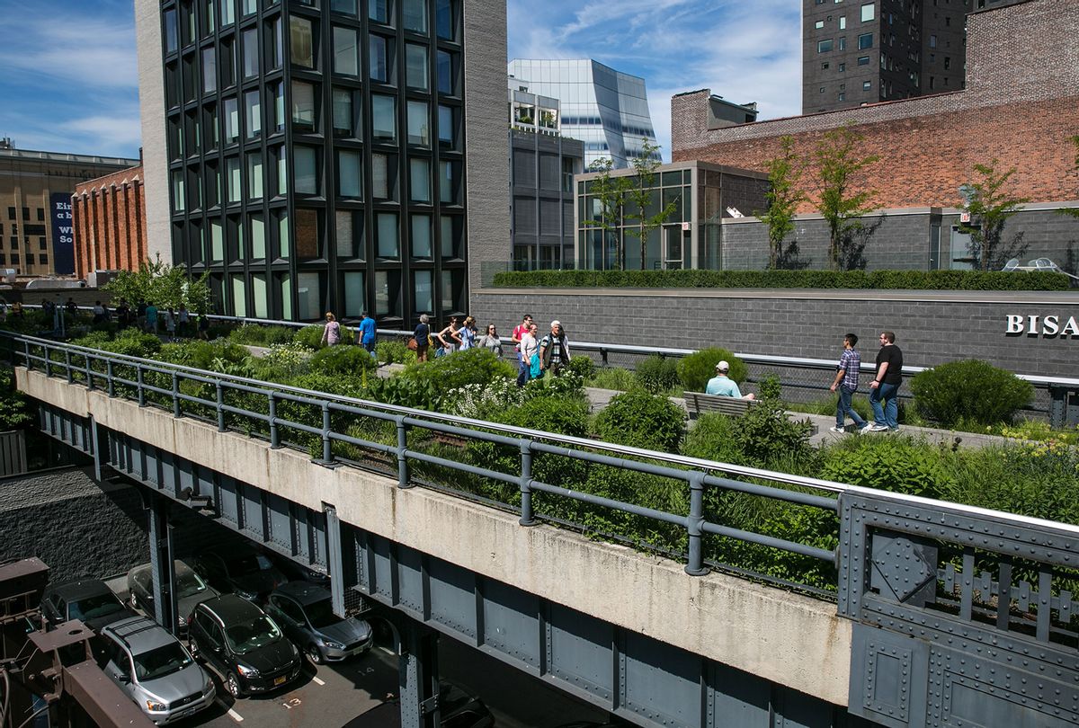 People walk along The High Line above the Meatpacking District on June 9, 2017 in New York City. With a full schedule of conventions and major sporting events taking place around the island of Manhattan each week, millions of global visitors will converge on New York City this year. (Photo by George Rose/Getty Images (George Rose/Getty Images)