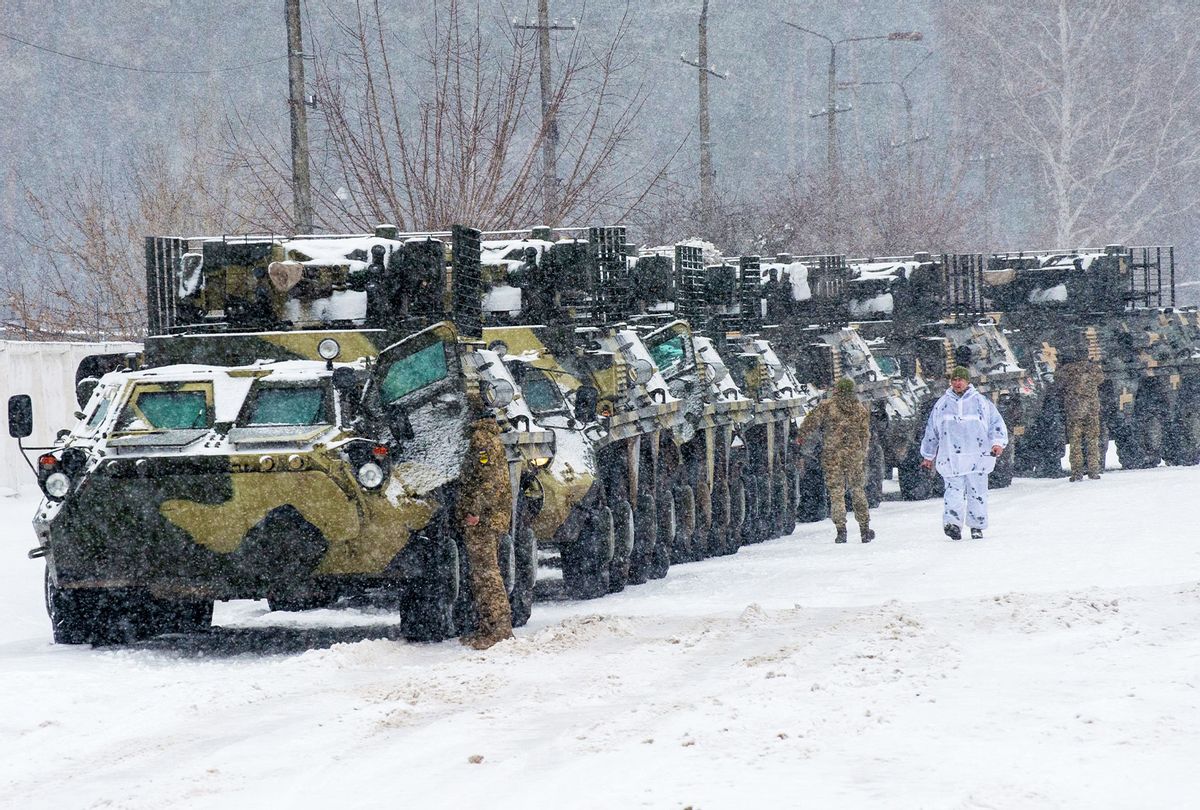 Armored personnel carrier (APC) of the 92nd separate mechanized brigade of Ukrainian Armed Forces move to park in their base near Klugino-Bashkirivka village, in the Kharkiv region on January 31, 2022. - The tanks have to restore their combat capability after completing a combat mission in war-torn eastern Ukraine. (SERGEY BOBOK/AFP via Getty Images)