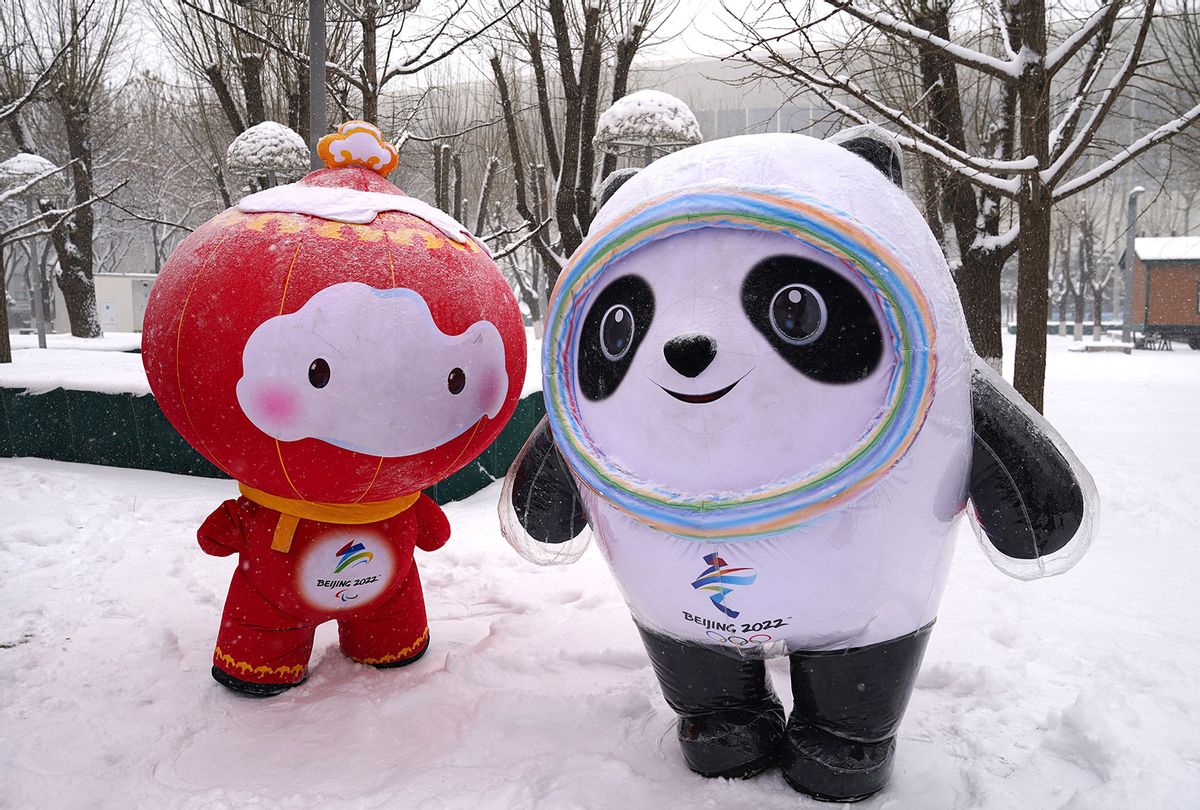 Beijing 2022 Winter Paralympics mascot Shuey Rhon Rhon and Olympics mascot Bing Dwen Dwen pose in the snow outside the Main Media Center on February 13, 2022 in Beijing, China. (Cui Nan/China News Service via Getty Images)