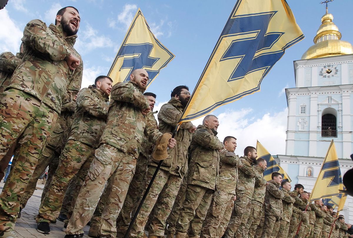 Ukrainian veterans of the 'Azov' volunteer battalion attend a rally dedicated to the Volunteer Day in honor of volonteer fighters who joined Ukrainian Army at a war conflict at eastern the country regions, in downtown of Kyiv, Ukraine, on 14 March, 2020. Several thousands Ukrainians including servicemen, volunteers and their supporters marched in central of Ukrainian capital despite the ban on holding mass events because of the COVID-19 coronavirus. (STR/NurPhoto via Getty Images)