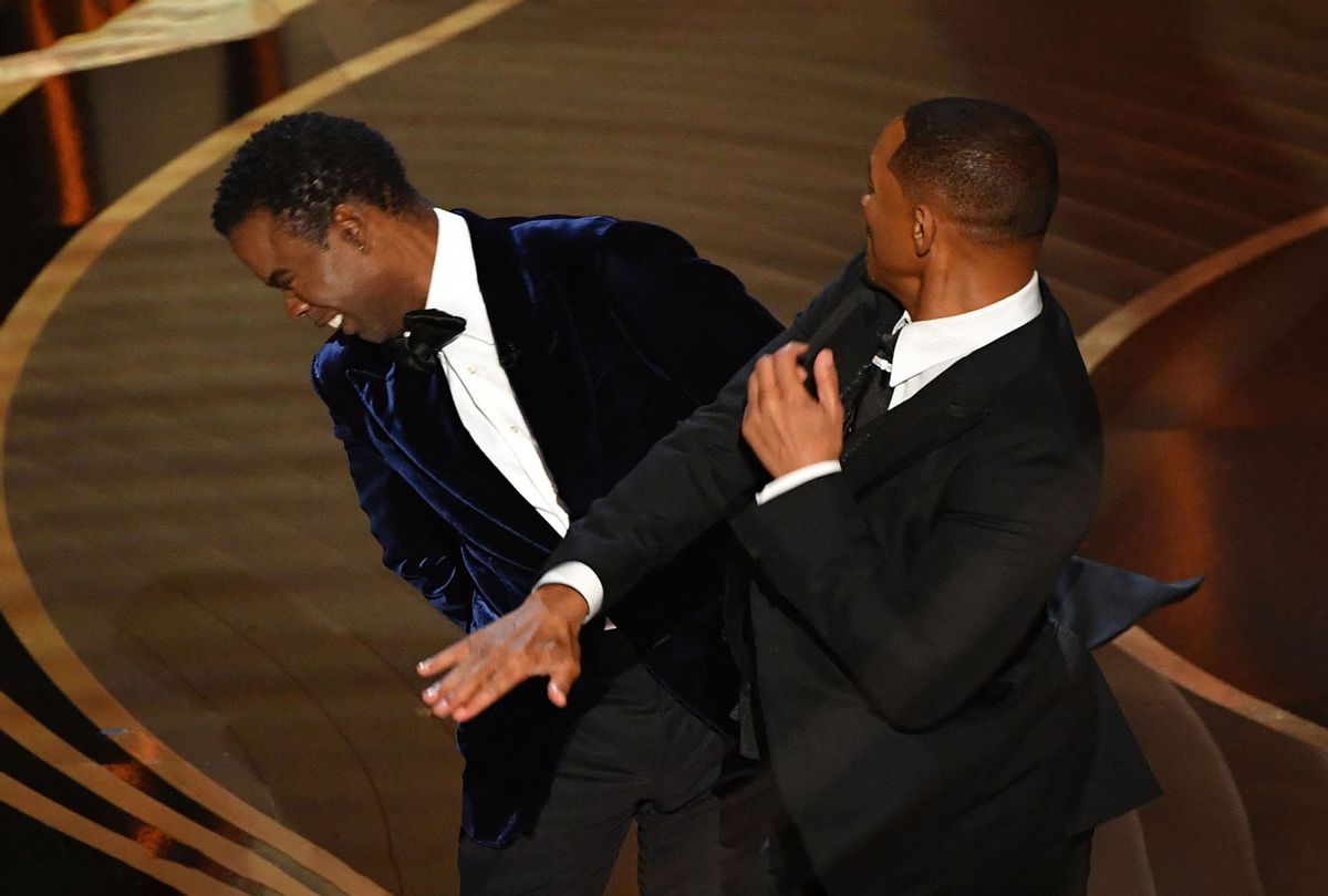 US actor Will Smith (R) slaps US actor Chris Rock onstage during the 94th Oscars at the Dolby Theatre in Hollywood, California on March 27, 2022. (ROBYN BECK/AFP via Getty Images)