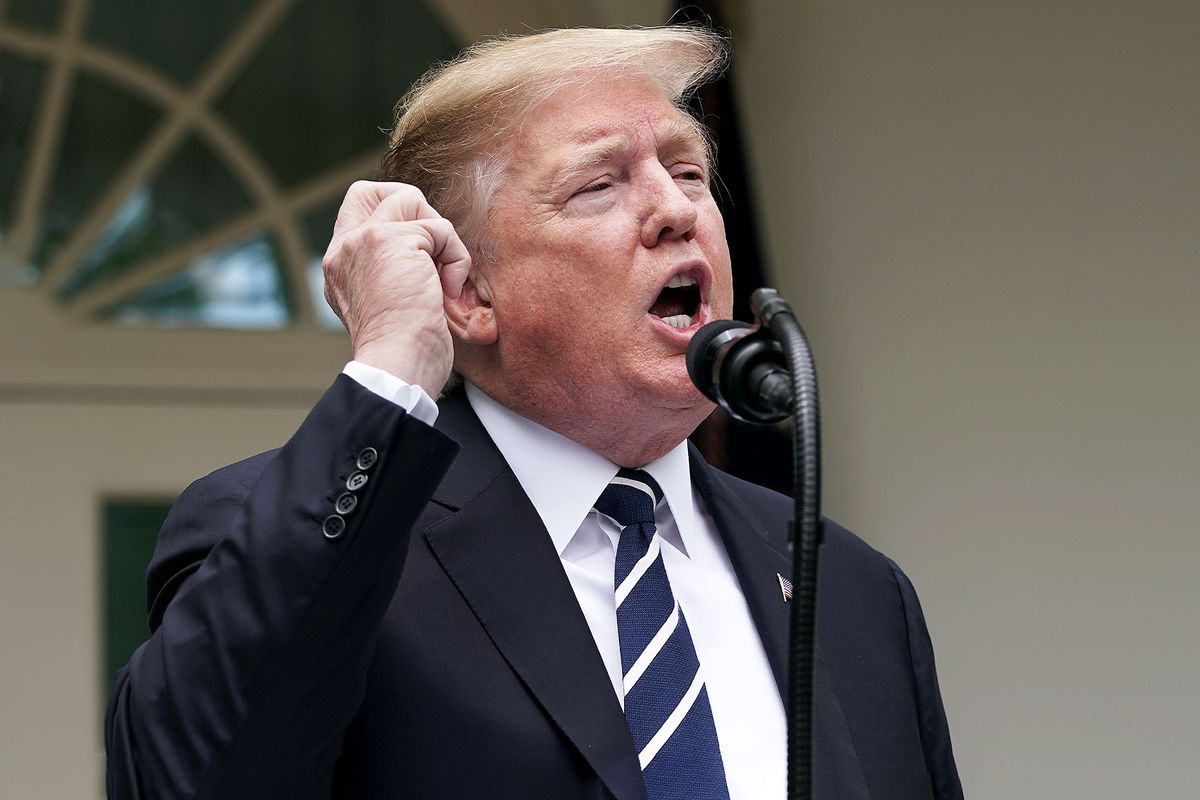 U.S. President Donald Trump pretends to make a phone call while speaking about Robert Mueller's investigation into Russian interference in the 2016 presidential election in the Rose Garden at the White House May 22, 2019 in Washington, DC. Trump responded to House Speaker Nancy Pelosi saying he was engaged in a cover up. (Chip Somodevilla/Getty Images)
