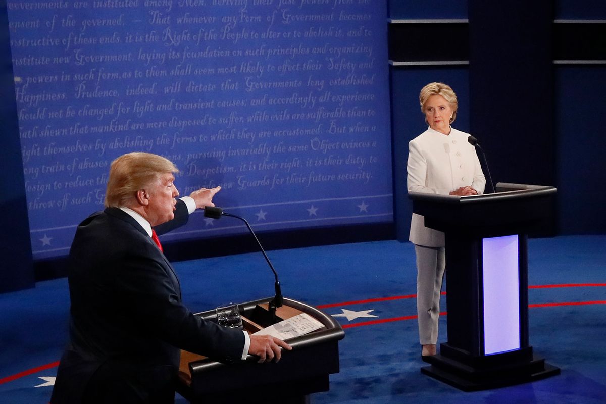 Republican nominee Donald Trump speaks as Democratic nominee Hillary Clinton looks on during the final presidential debate at the Thomas & Mack Center on the campus of the University of Las Vegas in Las Vegas, Nevada on October 19, 2016. (MARK RALSTON/AFP via Getty Images)