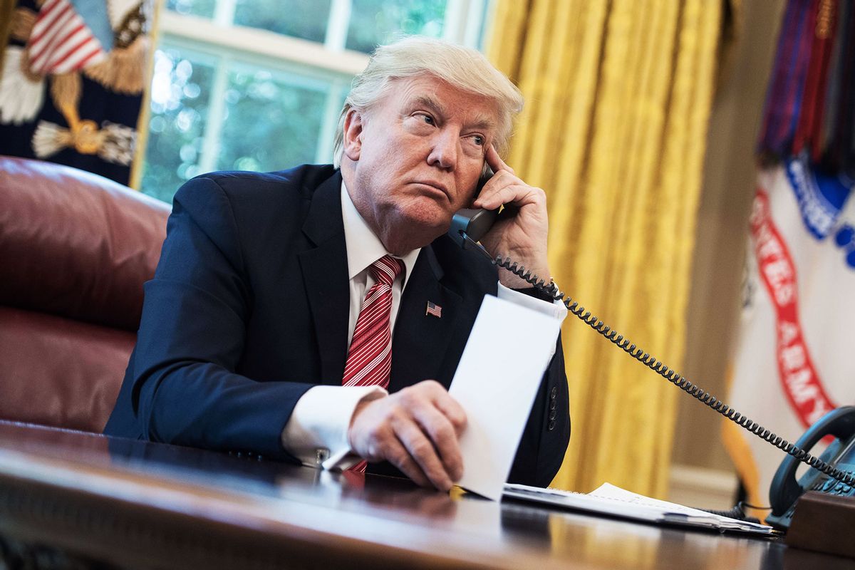 Former President Donald Trump waits to speak on the phone in the Oval Office at the White House in Washington, DC, on June 27, 2017. (NICHOLAS KAMM/AFP via Getty Images)
