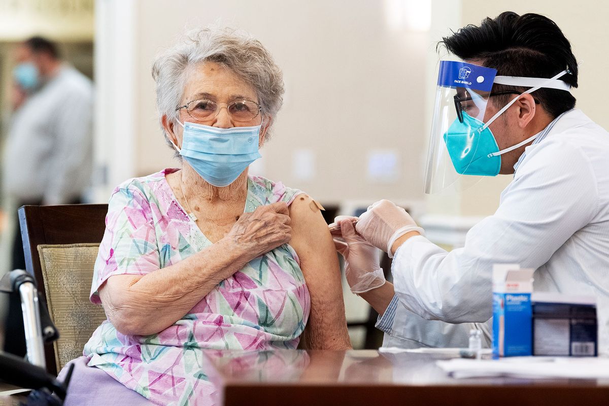 A CVS pharmacist gives the Pfizer/BioNTech COVID-19 vaccine to a resident at the Emerald Court senior living community in Anaheim, CA (Paul Bersebach/MediaNews Group/Orange County Register via Getty Images)