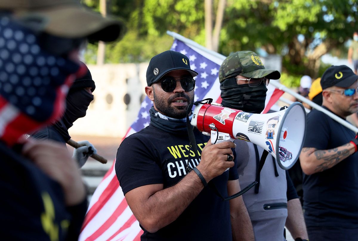 Enrique Tarrio, leader of the Proud Boys, uses a megaphone while counter-protesting people gathered at the Torch of Friendship to commemorate the one year anniversary of the killing of George Floyd on May 25, 2021 in Miami, Florida. (Joe Raedle/Getty Images)