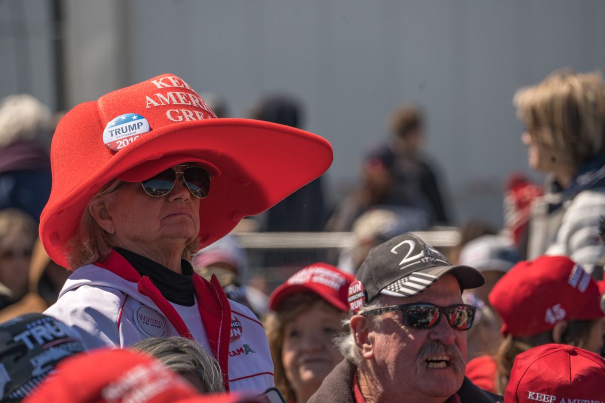 Supporters of former U.S. President Donald Trump wait for a rally at the Banks County Dragway on March 26, 2022 in Commerce, Georgia. This event is a part of Trump's "Save America Rally" around the United States where several current Republican candidates or politicians have been announced to speak at the event. (Photo by Megan Varner/Getty Images)