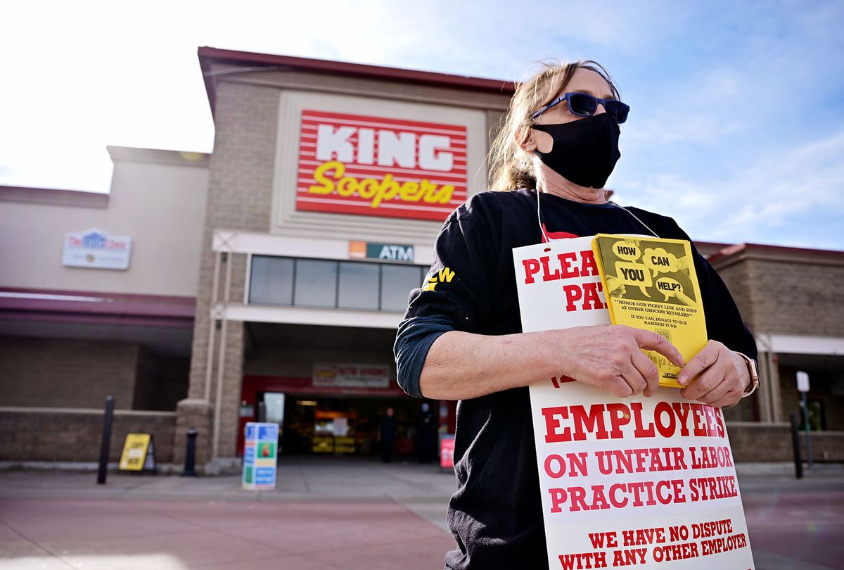 Suzy Vidger and members of United Food and Commercial Workers Local 7 ask support to the customers during the strike against King Soopers in front of the supermarket in Village Center in Highlands Ranch, Colorado on Wednesday, January 12, 2022. (Hyoung Chang/MediaNews Group/The Denver Post via Getty Images)